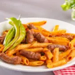 صوره عن طريقة عمل المكرونة بالسجق على أصولها